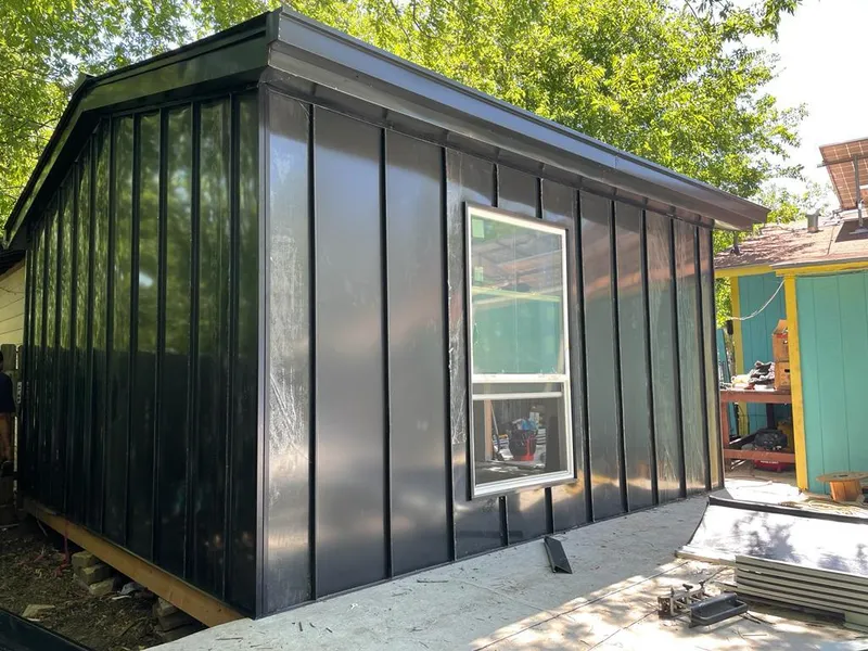 Black standing seam metal wall panels for Roof Inspection in Perinton