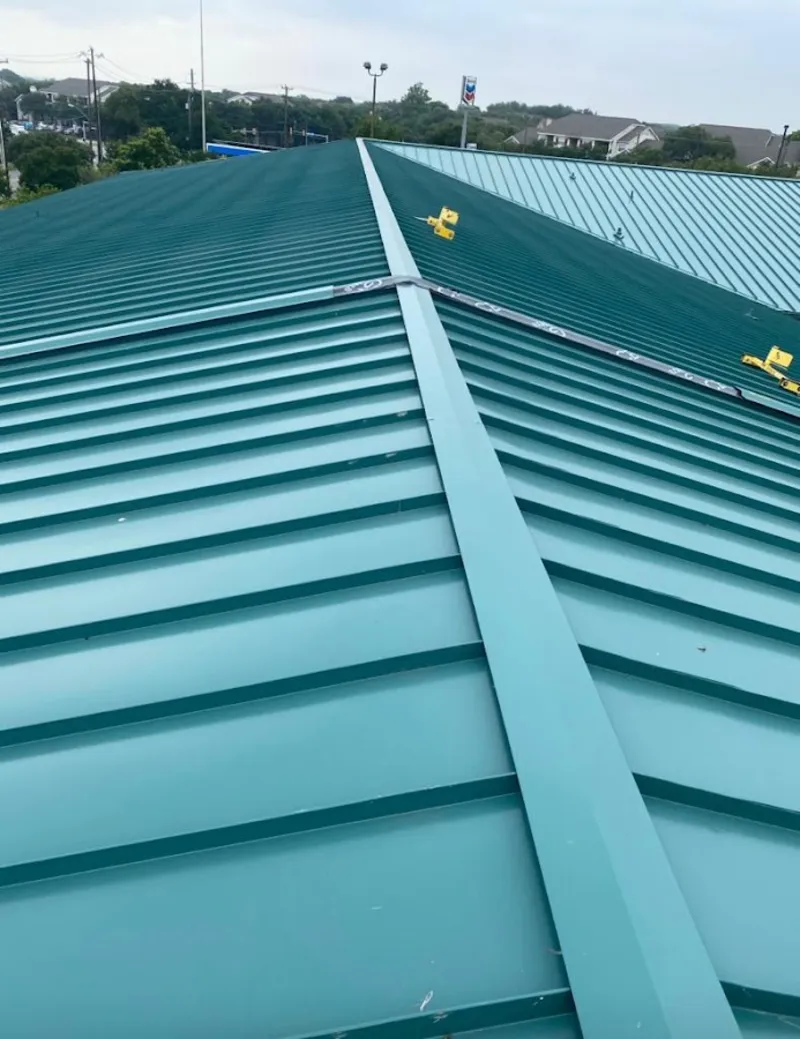 Green commercial metal roof ridge and valley for Metal Roof Repair in Perinton