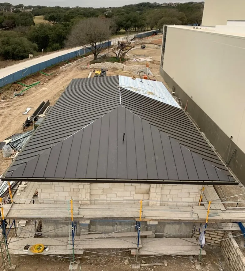 Metal roof new construction with scaffolding in Perinton