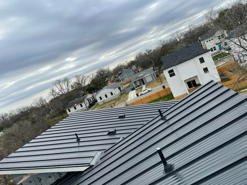 Standing seam metal roof panels with vents for Skylight Repair in Perinton